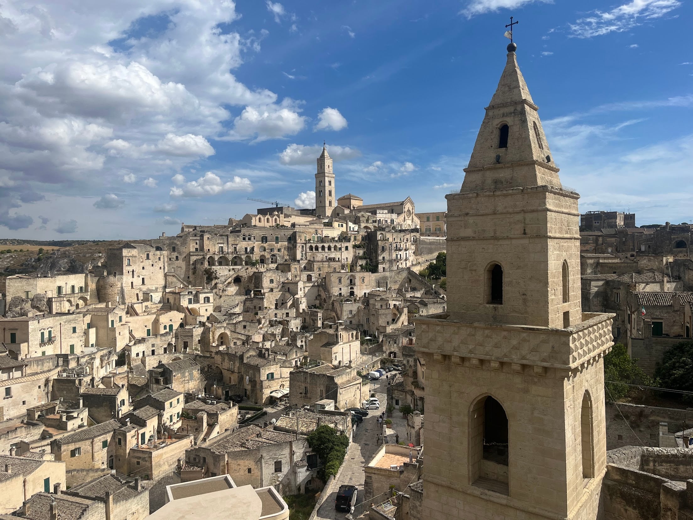 View across the Sassi di Matera with the cathedral bell tower on the skyline